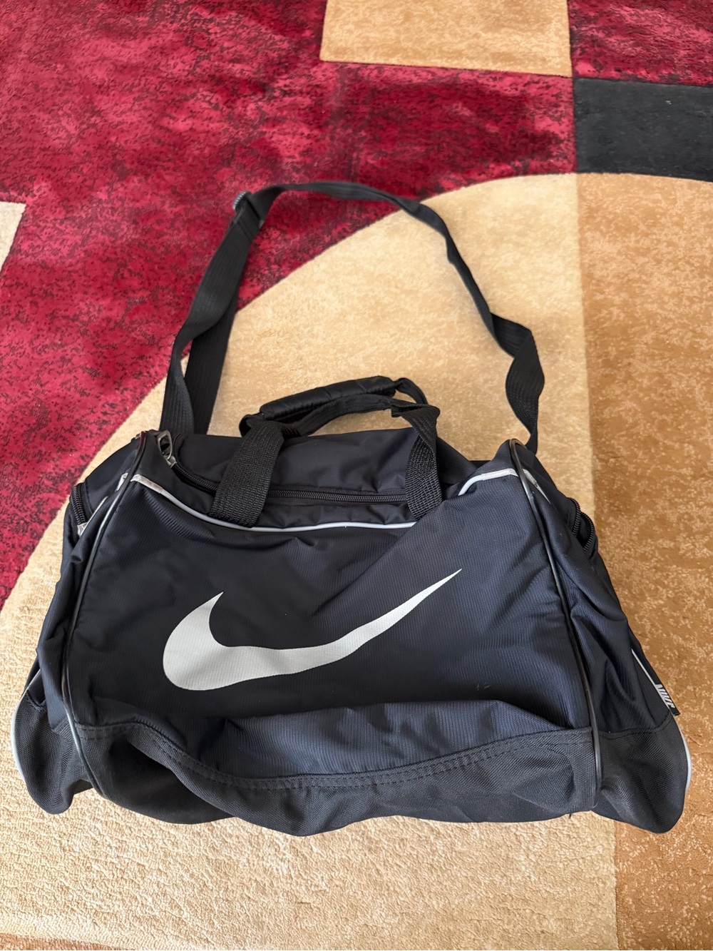 Nike Black Duffel Bag with White Swoosh